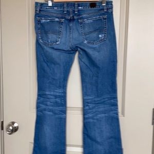 Lucky Brand baby bootcut, distressed denim jeans. Size 8 short. Gently worn.